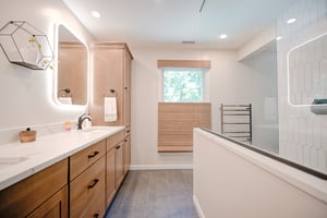 Conteporary Bathroom led vanity mirrors  medium tone wood vanity gray tile floor black plumbing fixtures and.