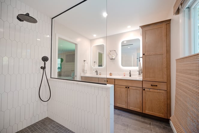 Bathroom remodel with luxury walk-in shower and dual vanity setup in Suffolk County custom home