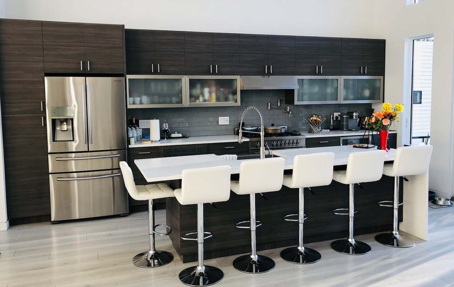 Modern kitchen white counters dark cabinets