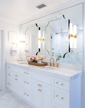  Tube sconce lighting along side double bathroom vanity mirrors